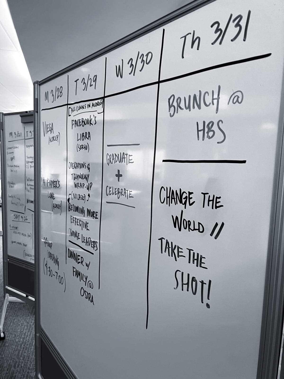 A whiteboard schedule for the final HBS week ending Graduate + Celebrate and Change the world, take the shot.