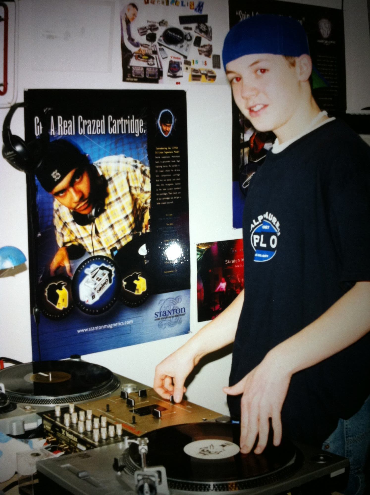 Teenage Brandon at his gold Stanton turntables in his bedroom, Stanton poster on the wall