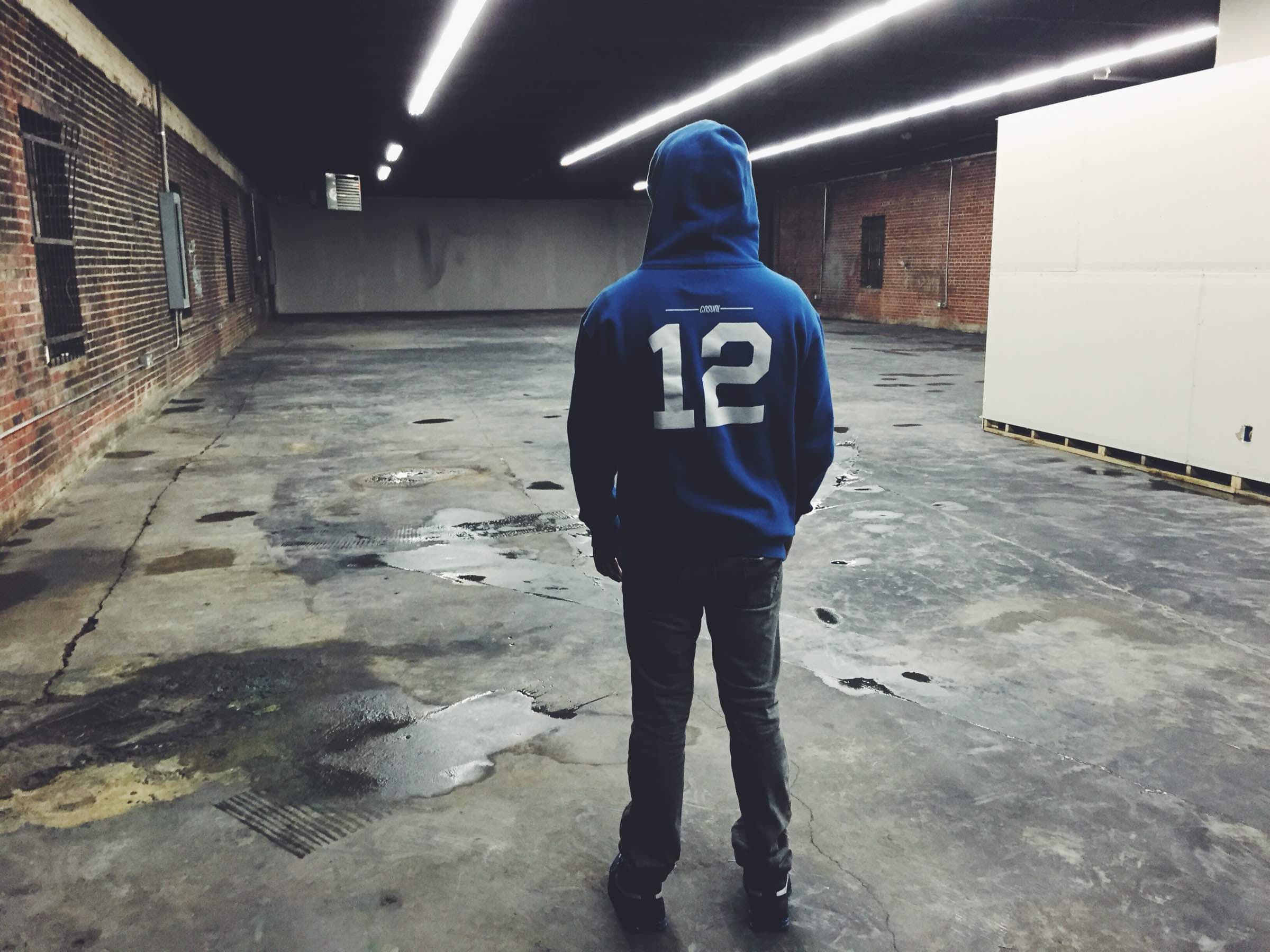 Lone figure in the empty, moody warehouse on Jewel Street