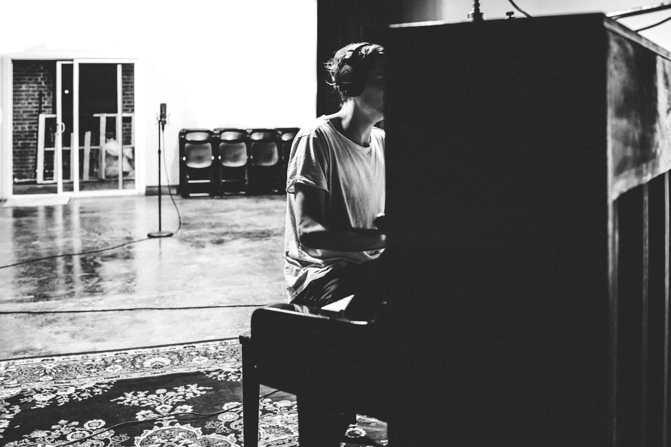 A musician at the upright piano in Studio A
