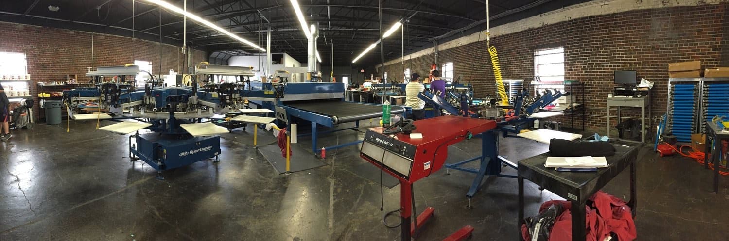 The screen printing operation running inside the warehouse