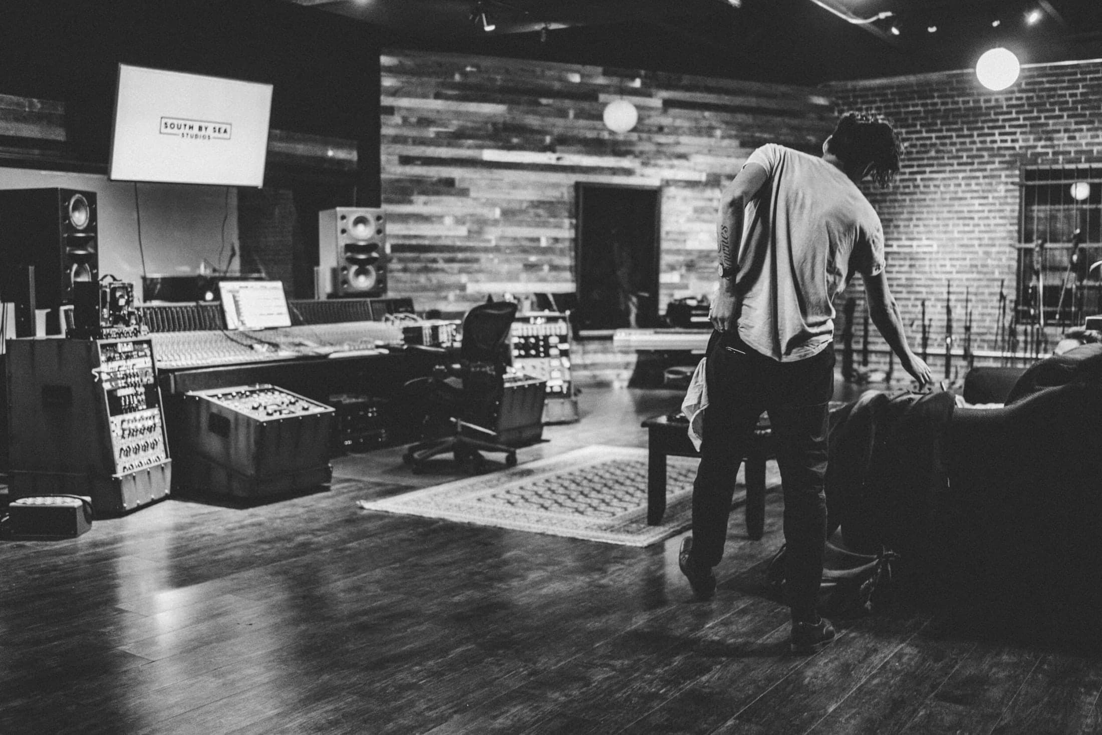 A musician beside the mixing console in Studio A