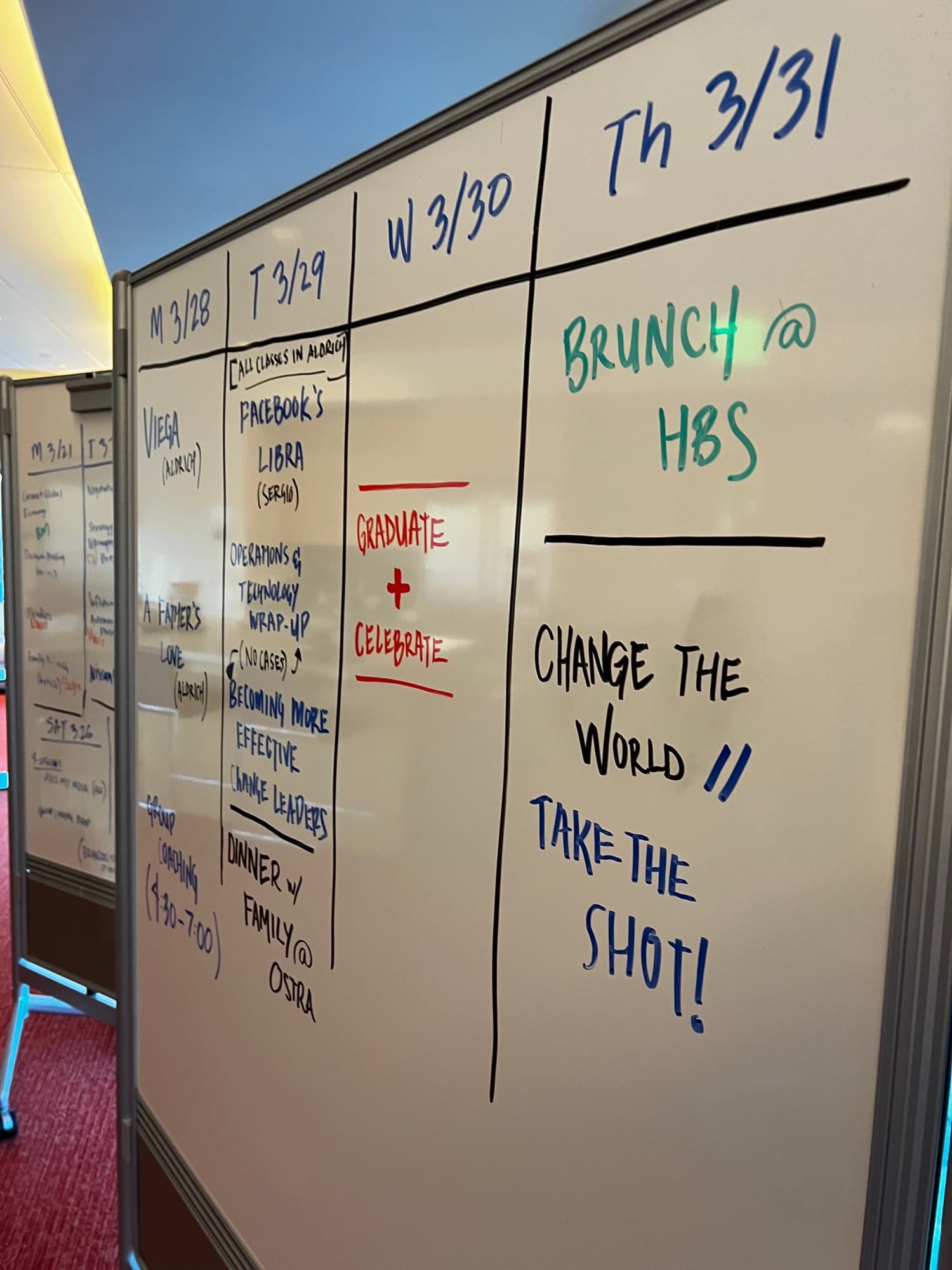 A whiteboard schedule for the final week at Harvard Business School, ending with the handwritten line CHANGE THE WORLD, TAKE THE SHOT